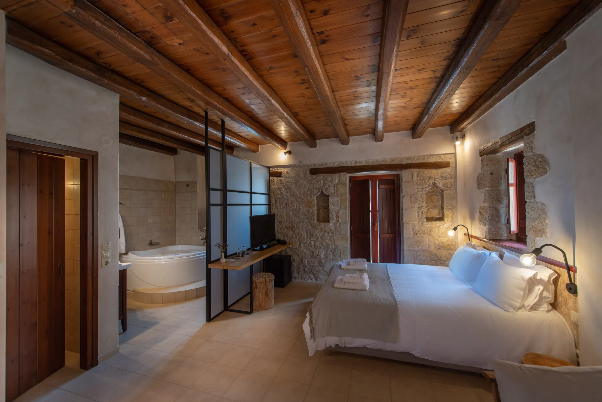 Premium Suite — indoor living space with jetted tub and sea view